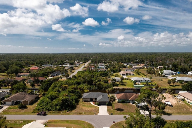 bird's eye view with a residential view and a wooded view