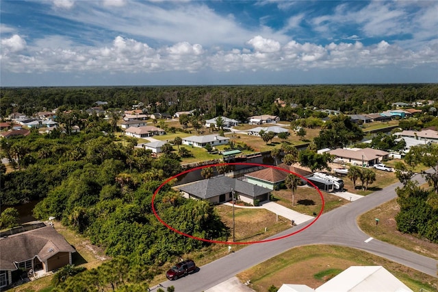 aerial view featuring a residential view and a view of trees