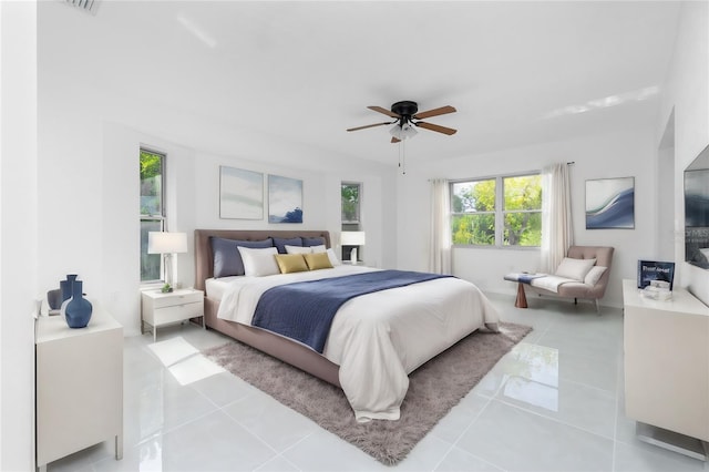 bedroom featuring ceiling fan and light tile patterned floors