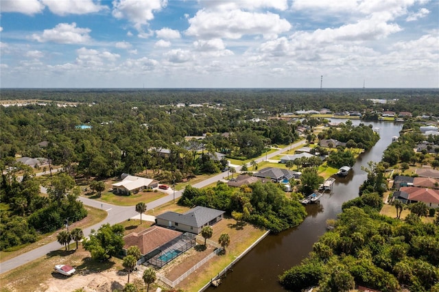 drone / aerial view with a residential view and a water view