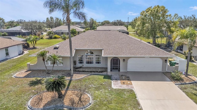 view of front of property featuring a garage and a front yard