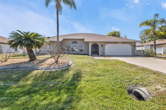 ranch-style house with a garage and a front lawn