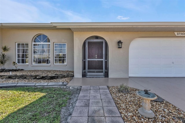 doorway to property featuring a garage