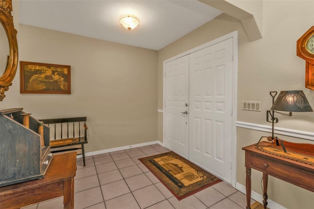 view of tiled foyer entrance