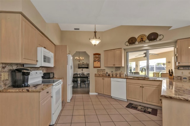 kitchen featuring pendant lighting, sink, white appliances, and light brown cabinets