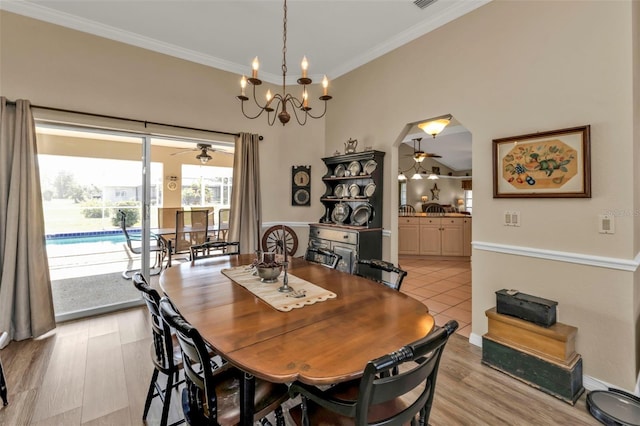 dining area featuring crown molding, ceiling fan, and light wood-type flooring