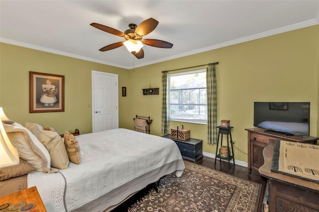 bedroom with ornamental molding, dark wood-type flooring, and ceiling fan