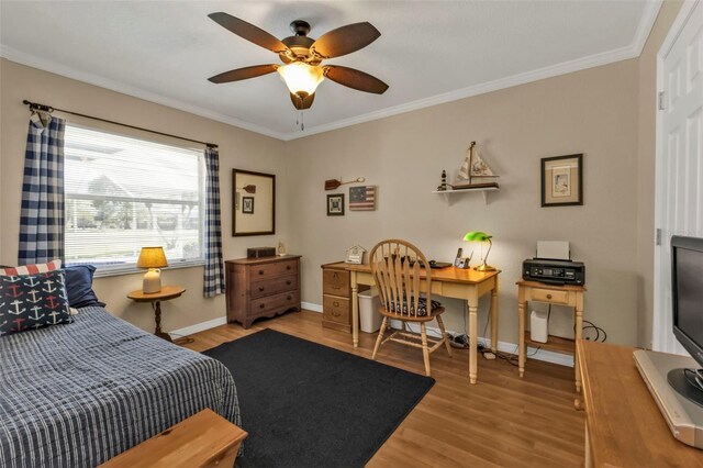 bedroom with crown molding, ceiling fan, and light wood-type flooring