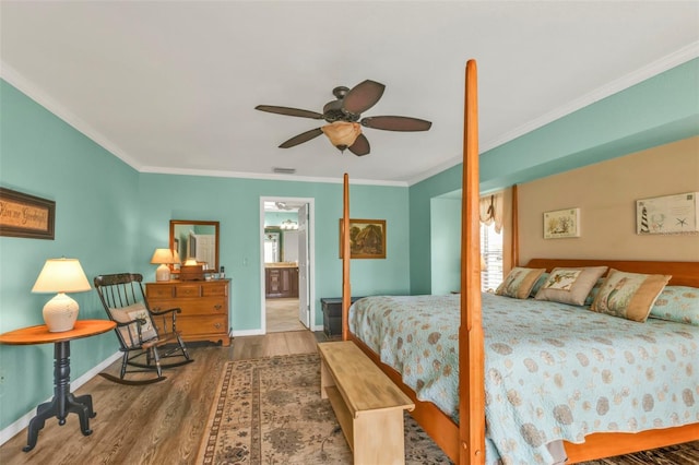 bedroom featuring wood-type flooring, ensuite bathroom, ceiling fan, and crown molding