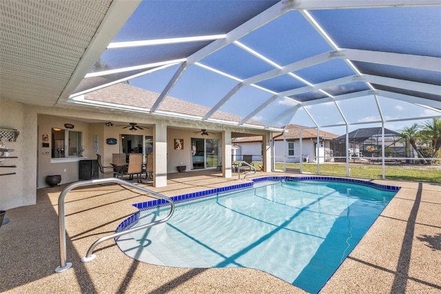 view of pool featuring a lanai, a patio, and ceiling fan