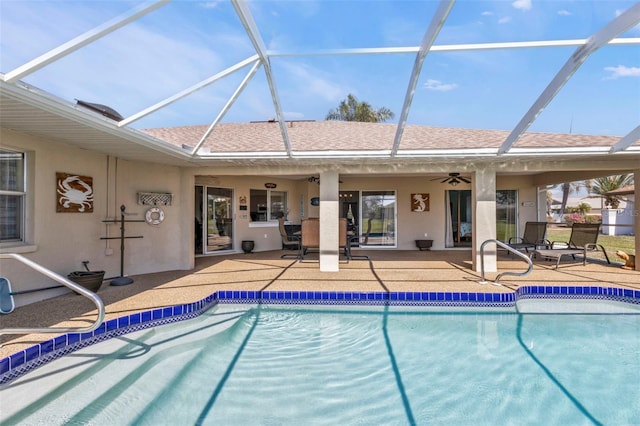 view of pool featuring ceiling fan, a lanai, and a patio