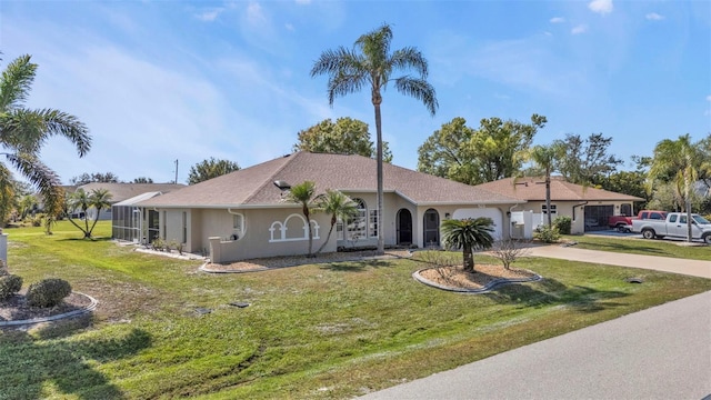 ranch-style home featuring a front lawn