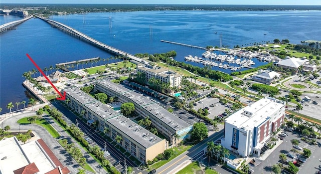 birds eye view of property with a water view