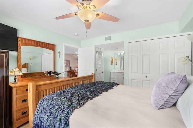 bedroom featuring ceiling fan and ensuite bathroom