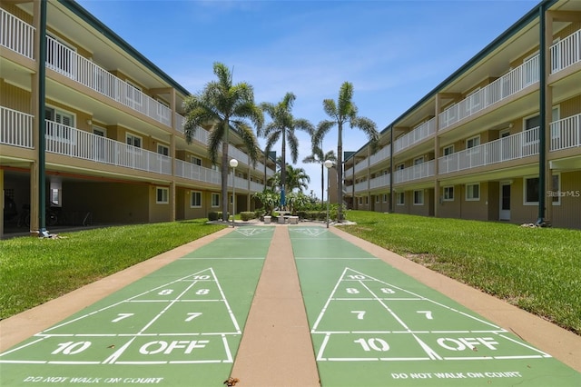 view of home's community featuring a yard