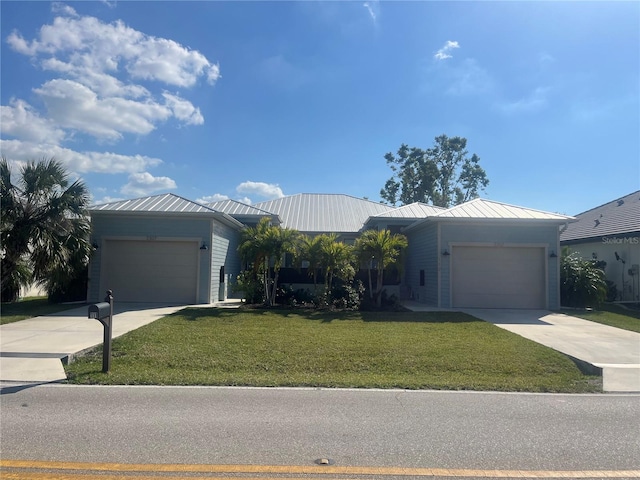 view of front facade with a garage and a front yard