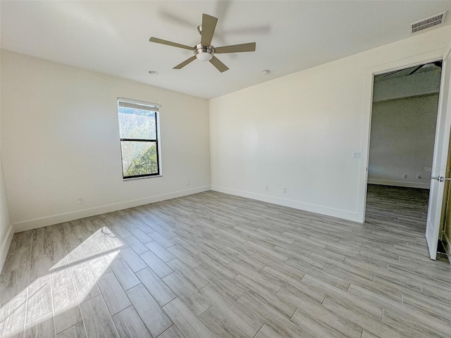 unfurnished room featuring ceiling fan and light wood-type flooring