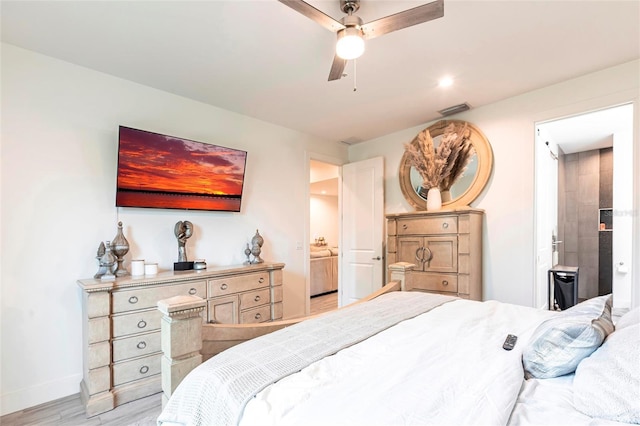 2709 Magdalina Dr Unit 101 102B, Punta Gorda, FL 33950 - bedroom featuring ensuite bathroom, light wood-type flooring, baseboards, and a ceiling fan