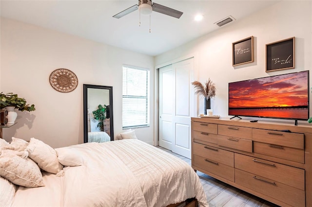 2709 Magdalina Dr Unit 101 102B, Punta Gorda, FL 33950 - bedroom with visible vents, ceiling fan, a closet, and light wood-style floors
