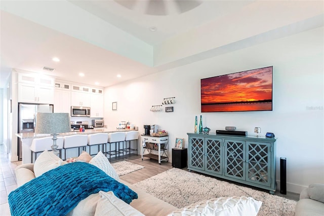 2709 Magdalina Dr Unit 101 102B, Punta Gorda, FL 33950 - living room with ceiling fan, light wood-style flooring, visible vents, recessed lighting, and baseboards