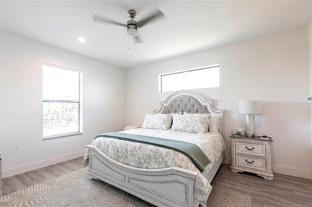 2709 Magdalina Dr Unit 101 102B, Punta Gorda, FL 33950 - bedroom with baseboards, a ceiling fan, and wood finished floors