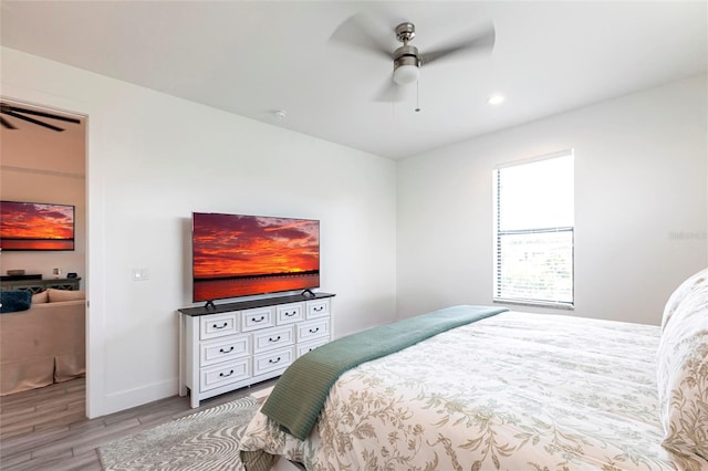 2709 Magdalina Dr Unit 101 102B, Punta Gorda, FL 33950 - bedroom featuring wood finished floors, ceiling fan, baseboards, and recessed lighting