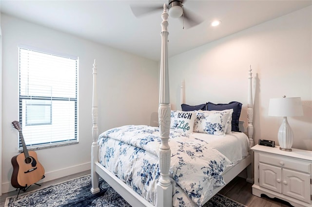 2709 Magdalina Dr Unit 101 102B, Punta Gorda, FL 33950 - bedroom featuring dark wood-style floors, multiple windows, baseboards, and ceiling fan