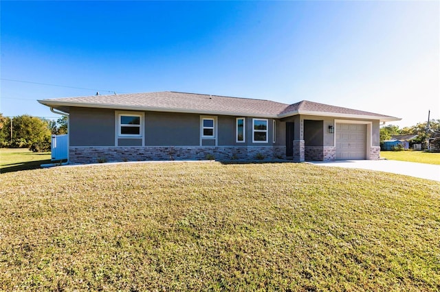 view of front of home with a garage and a front yard