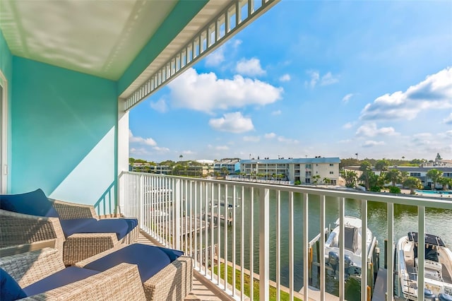 balcony featuring a water view