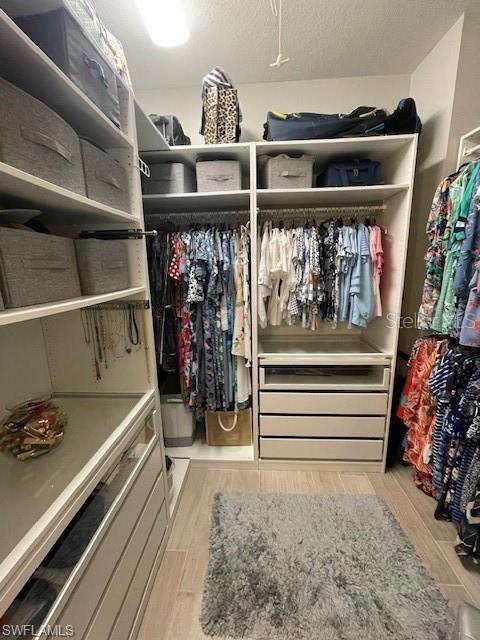 spacious closet featuring light wood-type flooring