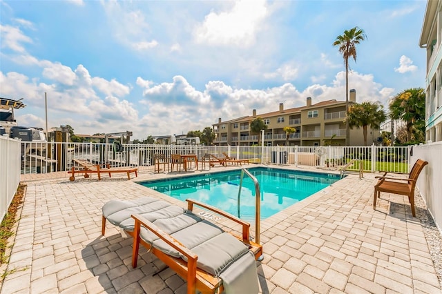 view of pool featuring a patio