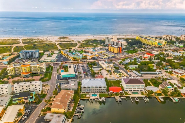 birds eye view of property featuring a water view and a view of city