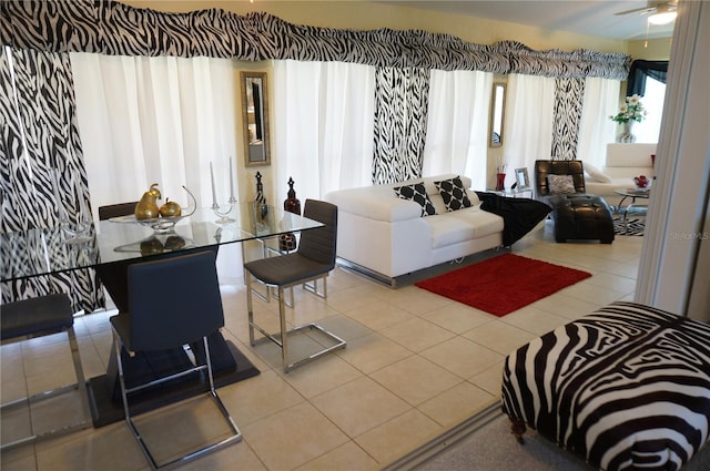 tiled living room featuring ceiling fan