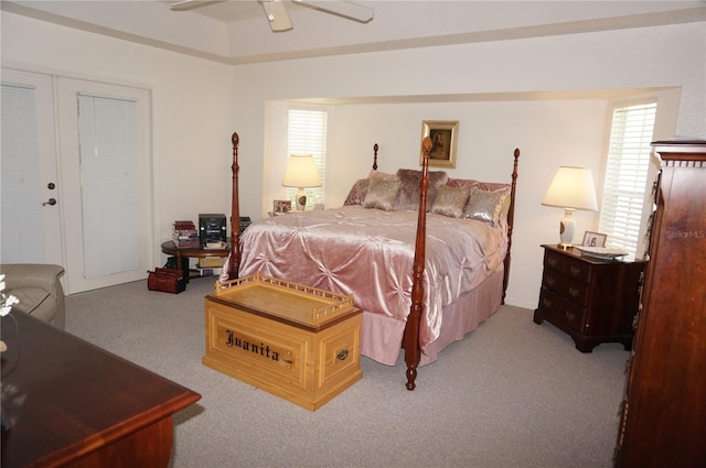 bedroom featuring light colored carpet and ceiling fan