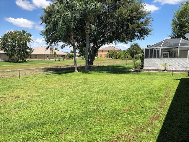 view of yard with a lanai