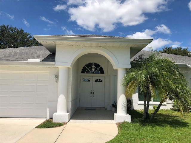 entrance to property featuring a garage