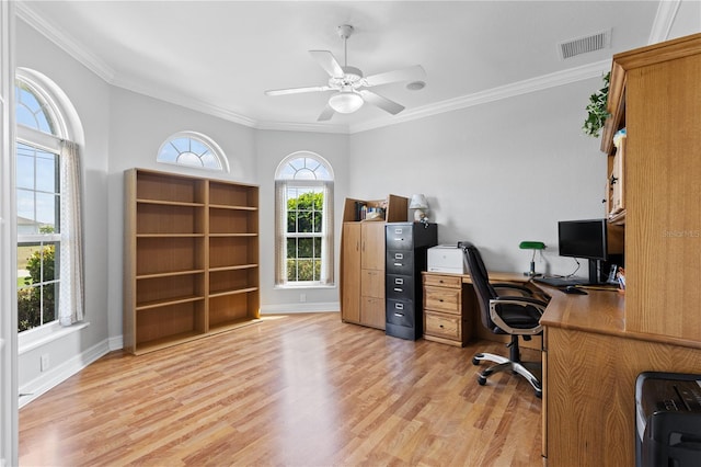 office with light wood-type flooring, baseboards, visible vents, and crown molding