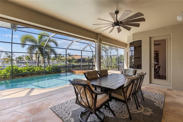 view of patio featuring an outdoor pool, a lanai, and ceiling fan