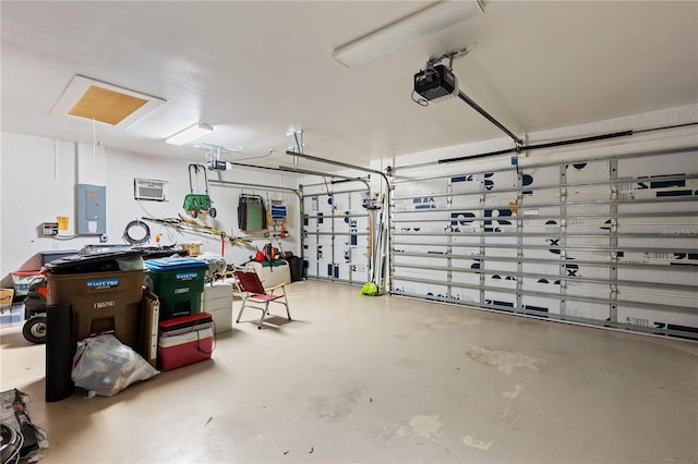 garage featuring a garage door opener and electric panel