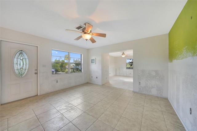 tiled entrance foyer featuring ceiling fan