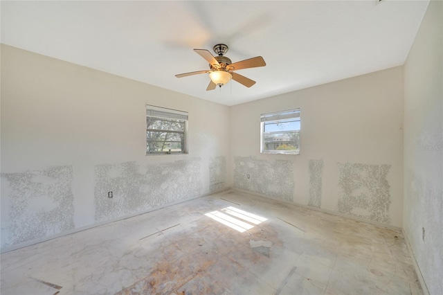 unfurnished room with ceiling fan