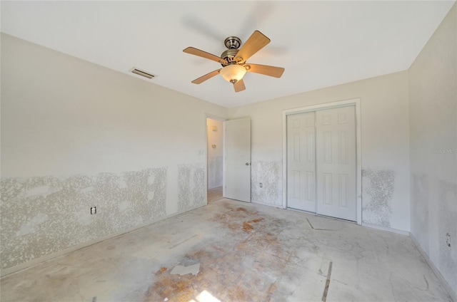 unfurnished bedroom with a closet and ceiling fan