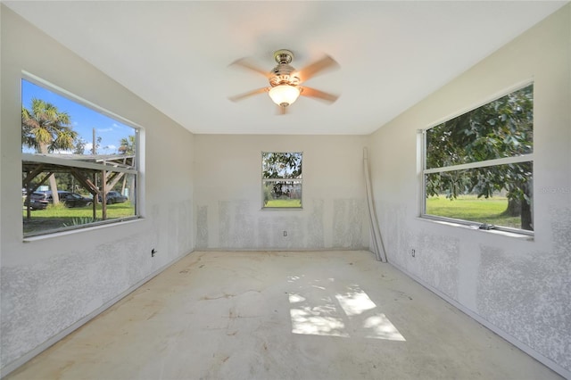 empty room with a healthy amount of sunlight and ceiling fan