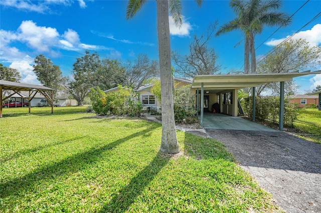 exterior space featuring a carport and a front yard