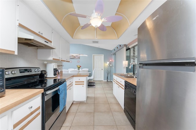 349 Grenada St, Port Charlotte, FL 33948 - kitchen with sink, light tile patterned floors, appliances with stainless steel finishes, white cabinets, and a raised ceiling