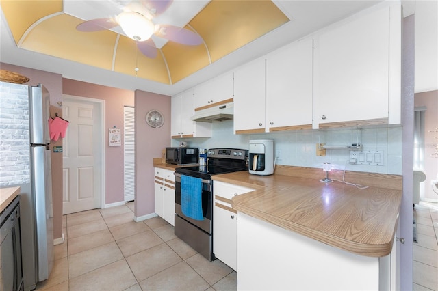 349 Grenada St, Port Charlotte, FL 33948 - kitchen with black appliances, white cabinets, light tile patterned floors, ceiling fan, and a tray ceiling