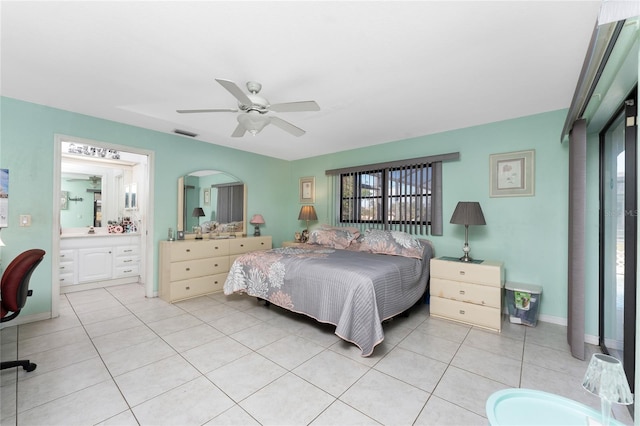 349 Grenada St, Port Charlotte, FL 33948 - bedroom with light tile patterned flooring, ensuite bath, and ceiling fan