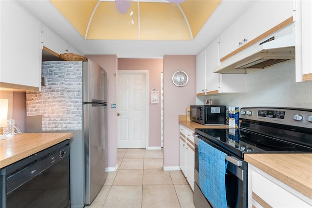 349 Grenada St, Port Charlotte, FL 33948 - kitchen with tasteful backsplash, light tile patterned flooring, white cabinets, and black appliances