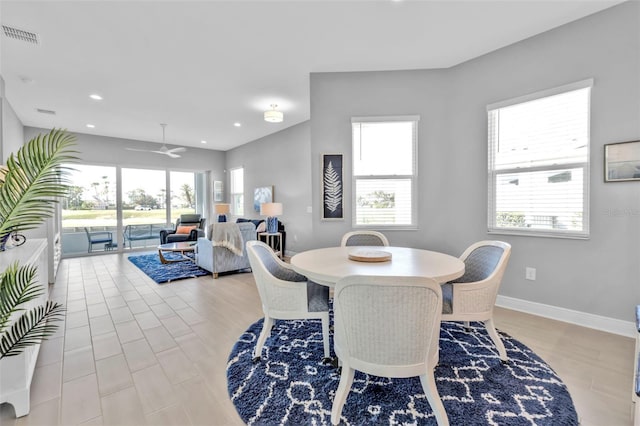 dining space with ceiling fan, light hardwood / wood-style flooring, and a healthy amount of sunlight