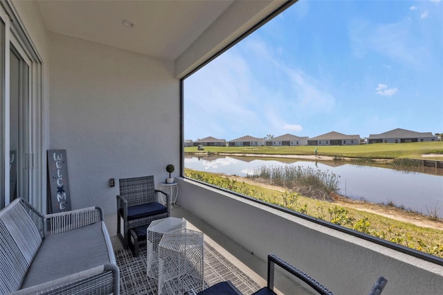 balcony featuring a water view